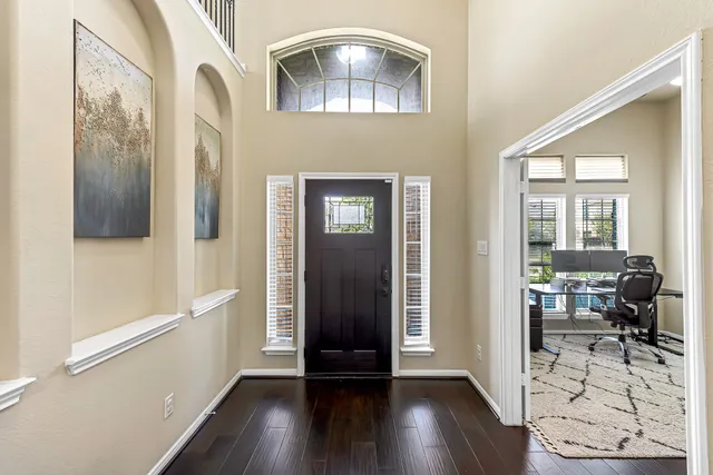 a view of livingroom with hardwood floor and hallway