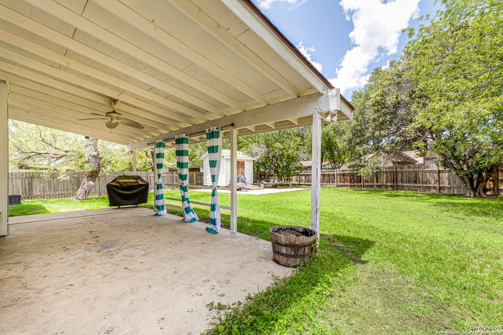 6719 Timberhill Leon Valley, TX 78238 - Photo 18 of 20 a view of a house with backyard and porch