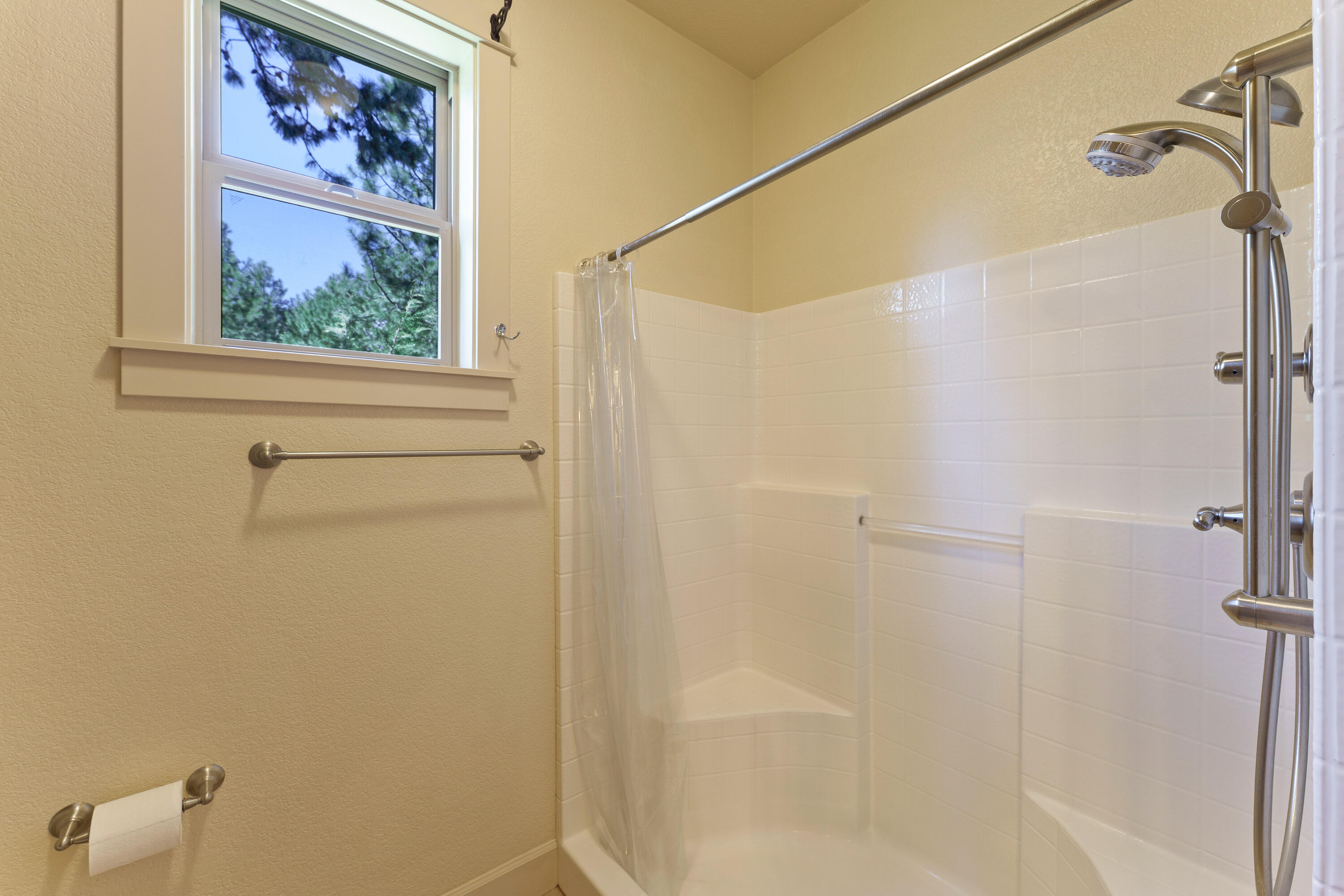 19236 Kiowa Road Bend, OR 97702 - Photo 29 of 52 a bathroom with a picture on the wall and shower