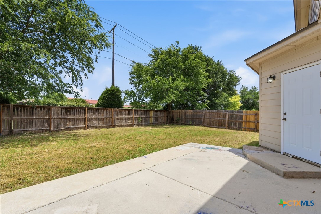8716 Starview Street Temple, TX 76502 - Photo 28 of 36 View of the backyard featuring a patio area and a wooden privacy fence.