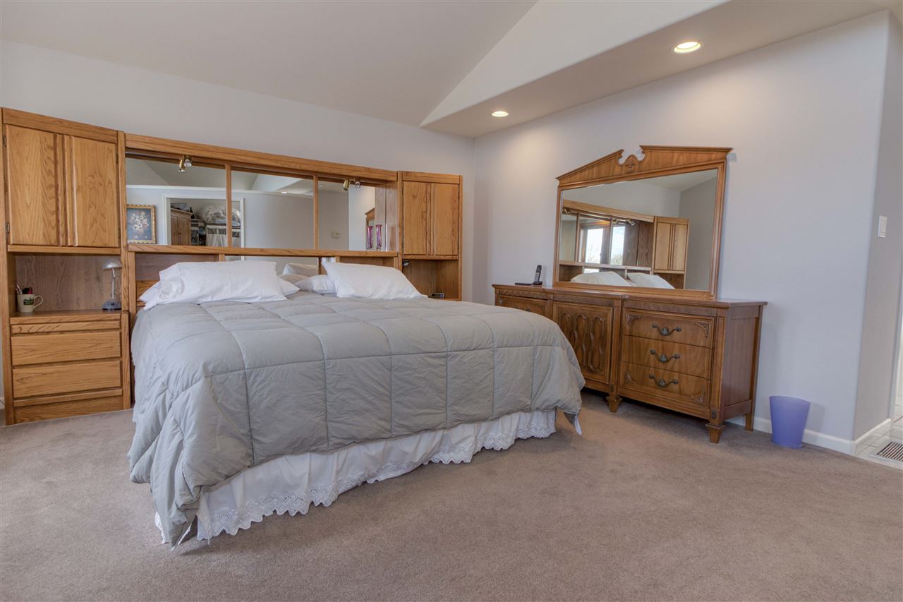 1130 23 Road Grand Junction, CO 81505 - Photo 9 of 30 a spacious bedroom with a bed and a dresser