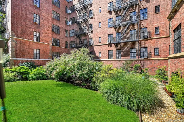 a view of a building with a yard