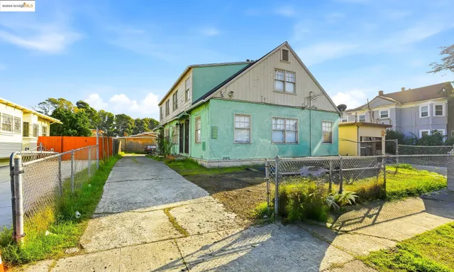 a front view of a house with swimming pool having outdoor seating