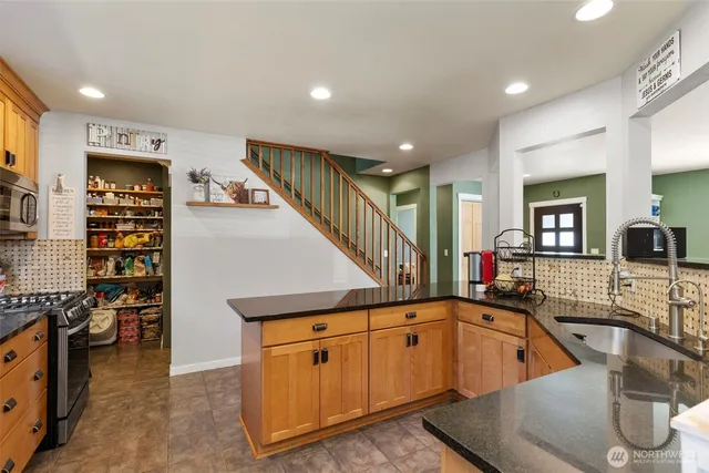 a living room with furniture window and wooden floor
