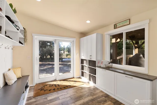 a kitchen with a refrigerator and a stove top oven