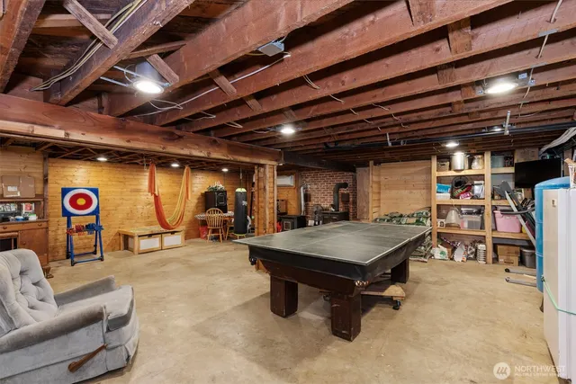 a living room with lots of furniture and kitchen view