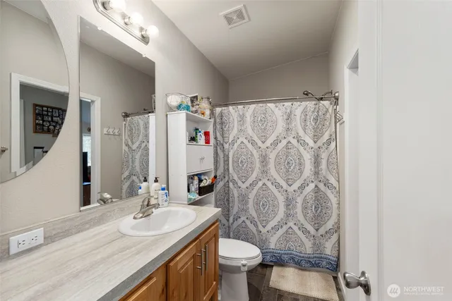 a bedroom with bed and a window