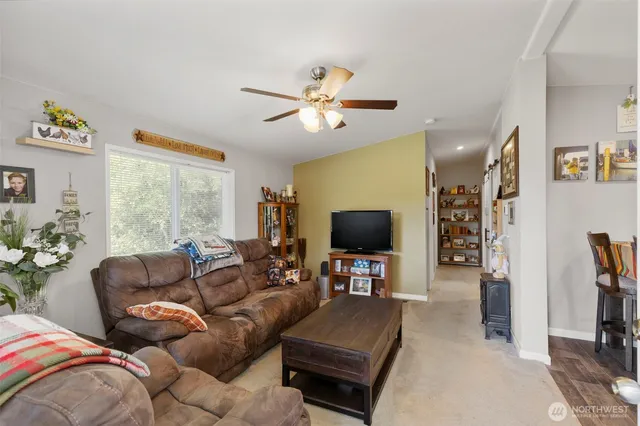 a backyard of a house with a yard and outdoor seating