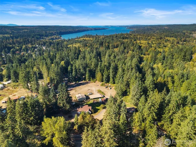 a view of a house with backyard porch and sitting area