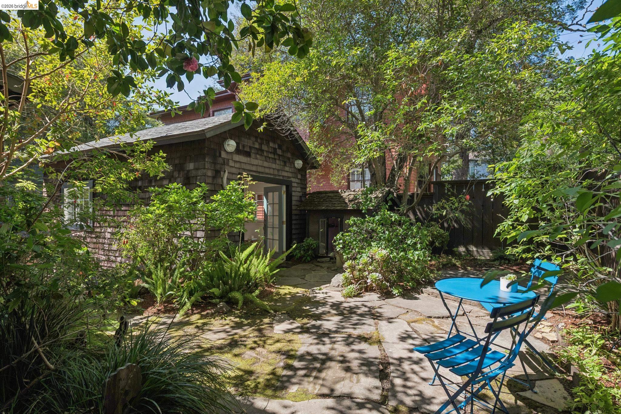 1490 Arch Street Berkeley, CA 94708 - Photo 44 of 57 a backyard of a house with table and chairs