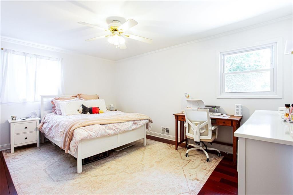 2814 Goodfellows Road Tucker, GA 30084 - Photo 24 of 46 a bedroom with a bed and a chandelier