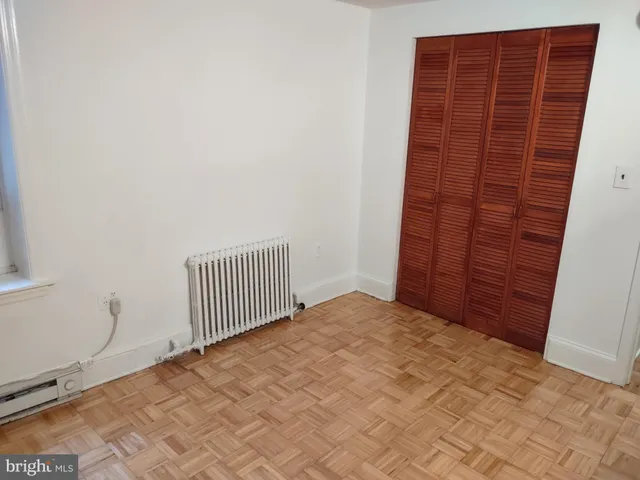 a view of wooden floor in an empty room