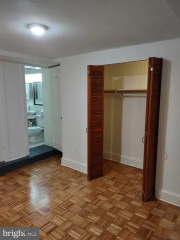 a bathroom with a sink toilet and mirror
