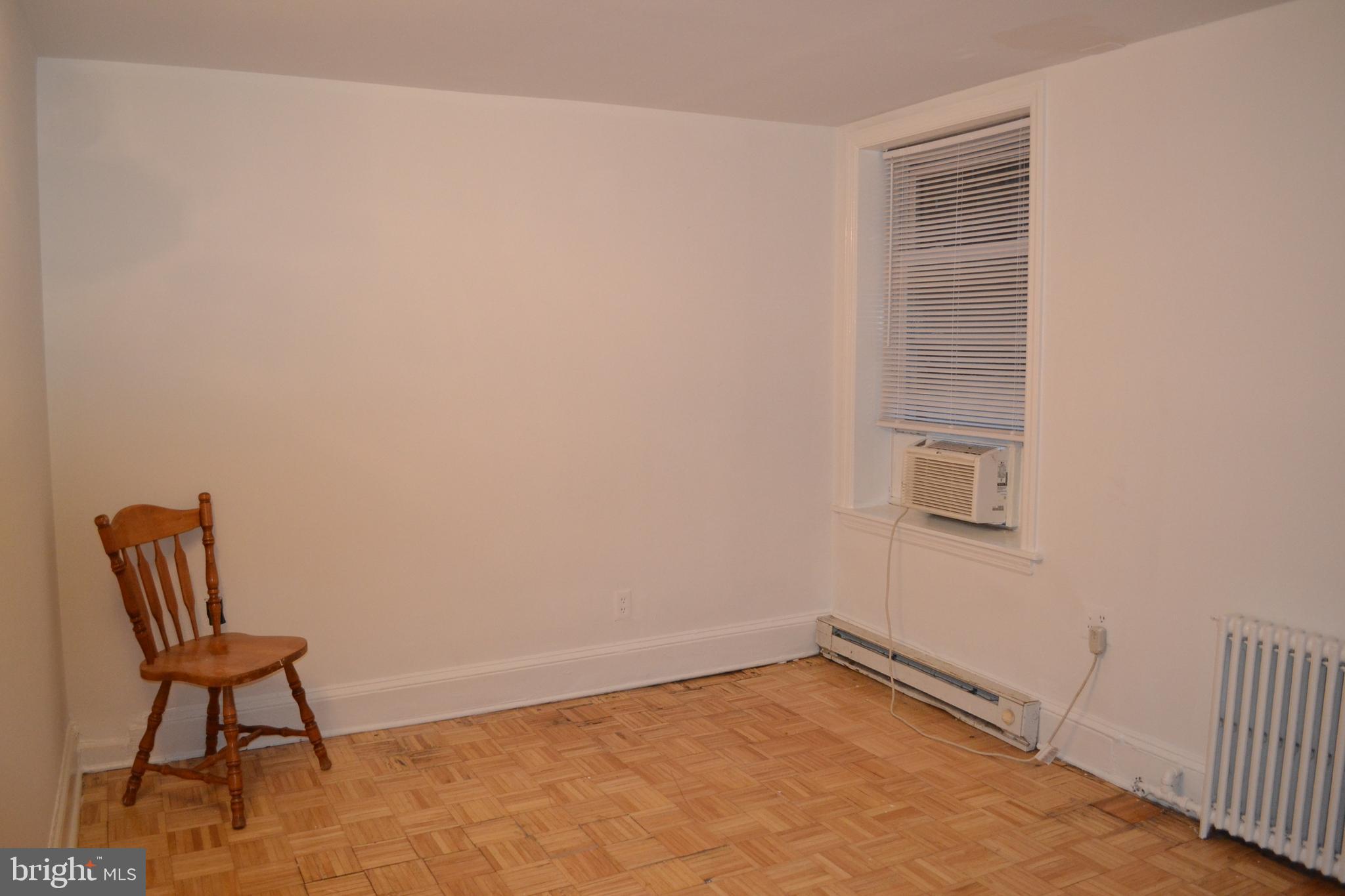 810 D Street Southeast, Unit B Washington, DC 20003 - Photo 7 of 26 a view of room with window and a chair