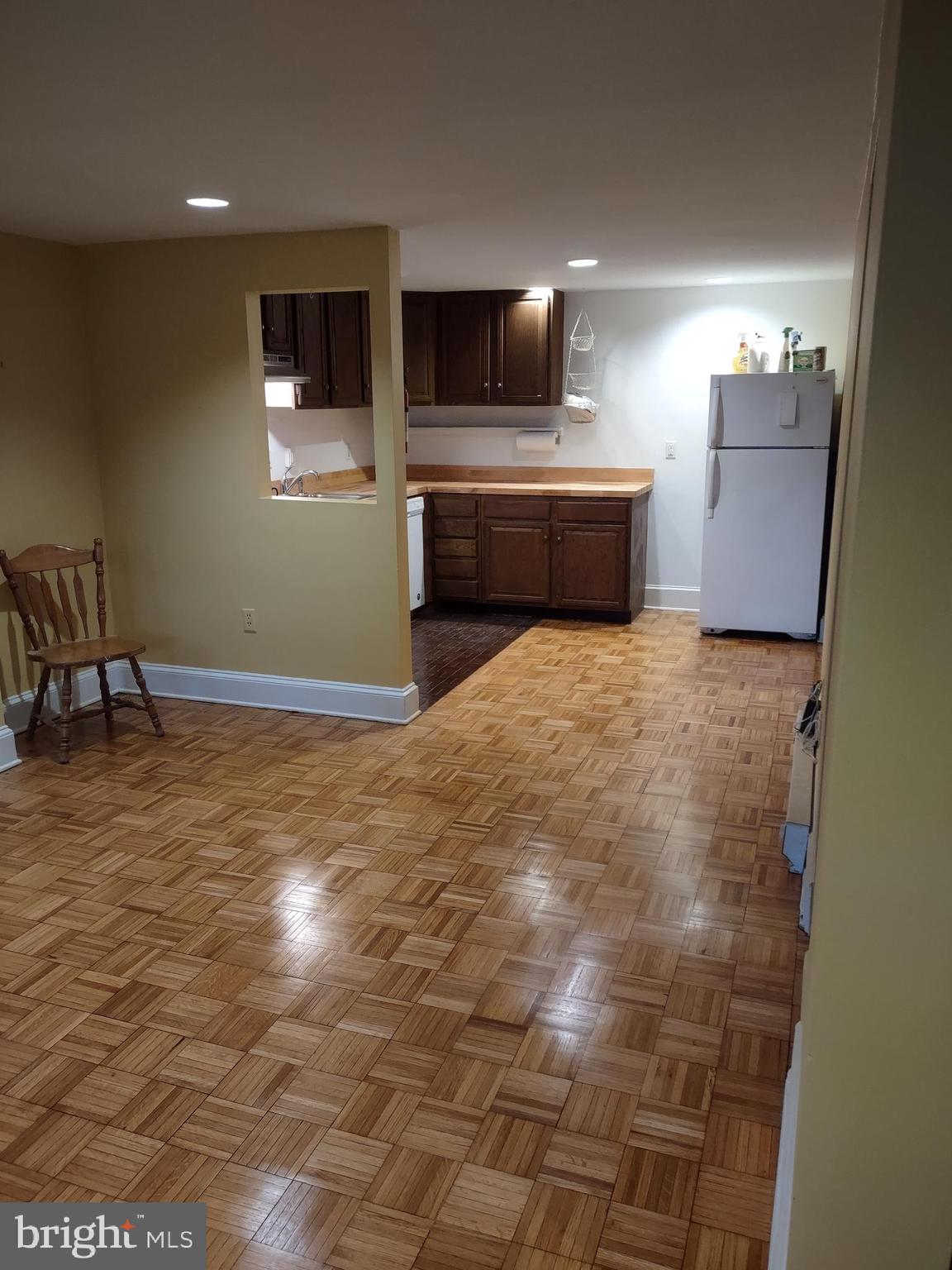 810 D Street Southeast, Unit B Washington, DC 20003 - Photo 8 of 26 a room with a bed and a flat screen tv