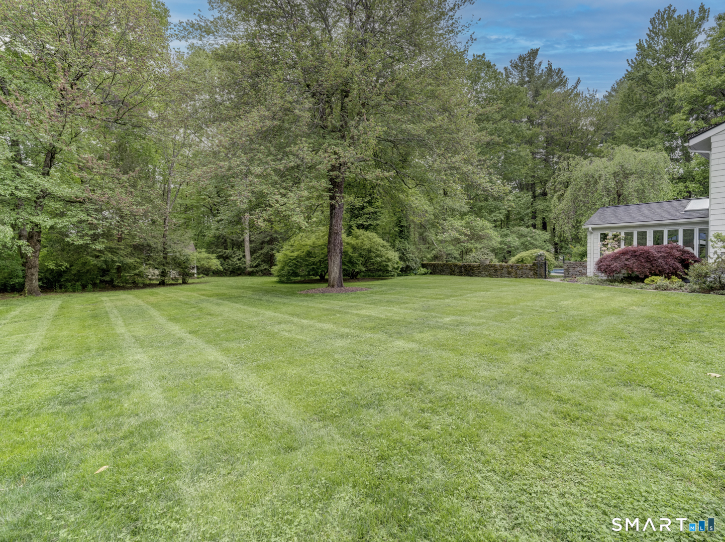 78 Windtree Street Torrington, CT 06790 - Photo 6 of 40 a view of a field of grass and trees