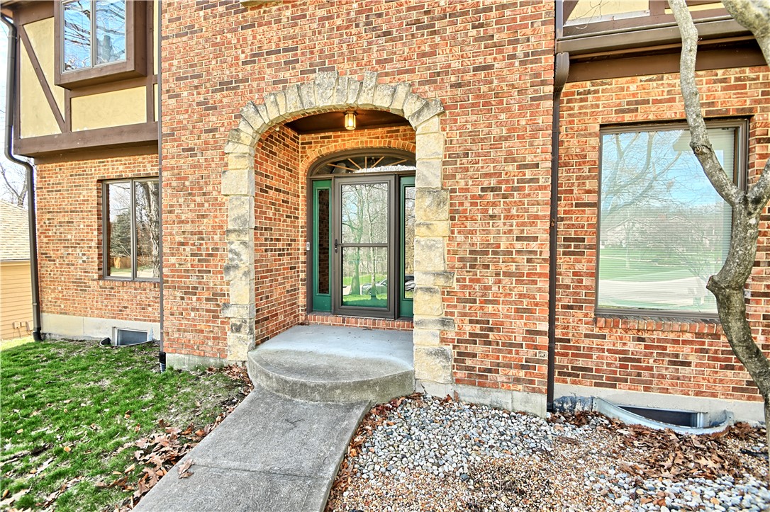 8711 Nicole Lane Springboro, OH 45066 - Photo 5 of 87 Welcome to this inviting brick home featuring an arched stone entrance and beautiful natural surroundings.