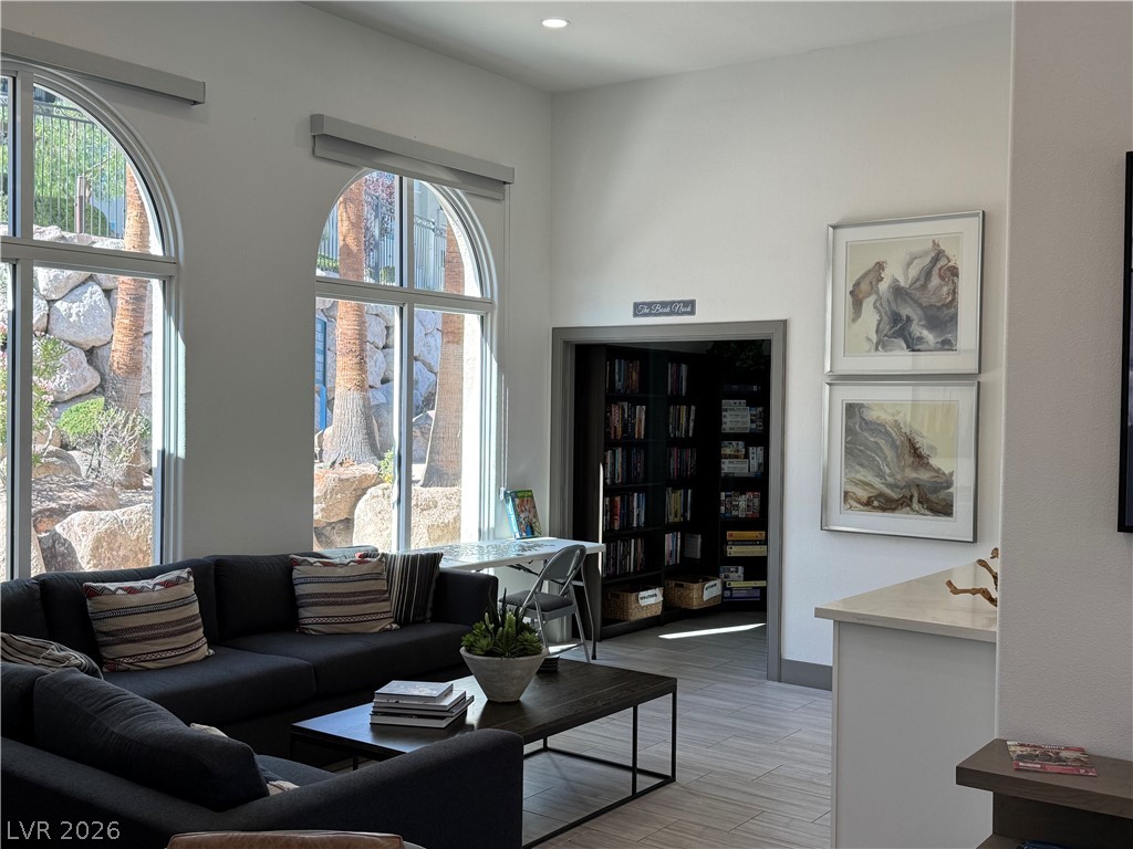 2555 Hampton Road, Unit 4205 Henderson, NV 89052 - Photo 39 of 52 This living space offers arched windows, sleek flooring, and a dedicated library nook.