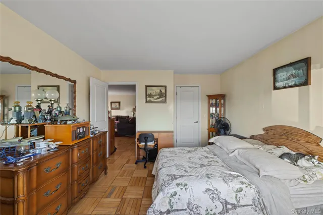 a bed room with a bed and dresser