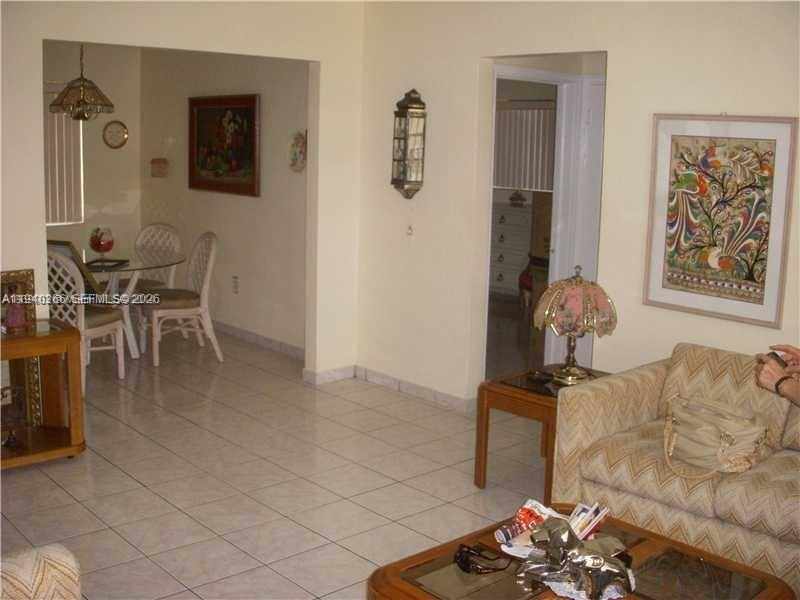 631 Southwest 11th Street, Unit 3W Miami, FL 33129 - Photo 2 of 3 a view of a livingroom with furniture and gym equipment