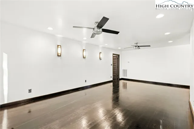 a bathroom with a sink toilet and mirror