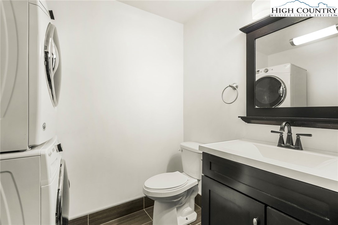 178 Brook Lane Boone, NC 28607 - Photo 16 of 48 a bathroom with a sink toilet and mirror