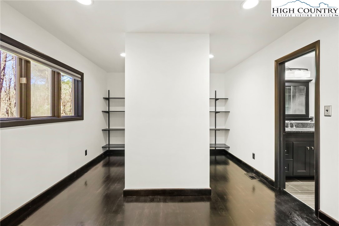 178 Brook Lane Boone, NC 28607 - Photo 21 of 48 a view of a hallway with wooden floor and staircase