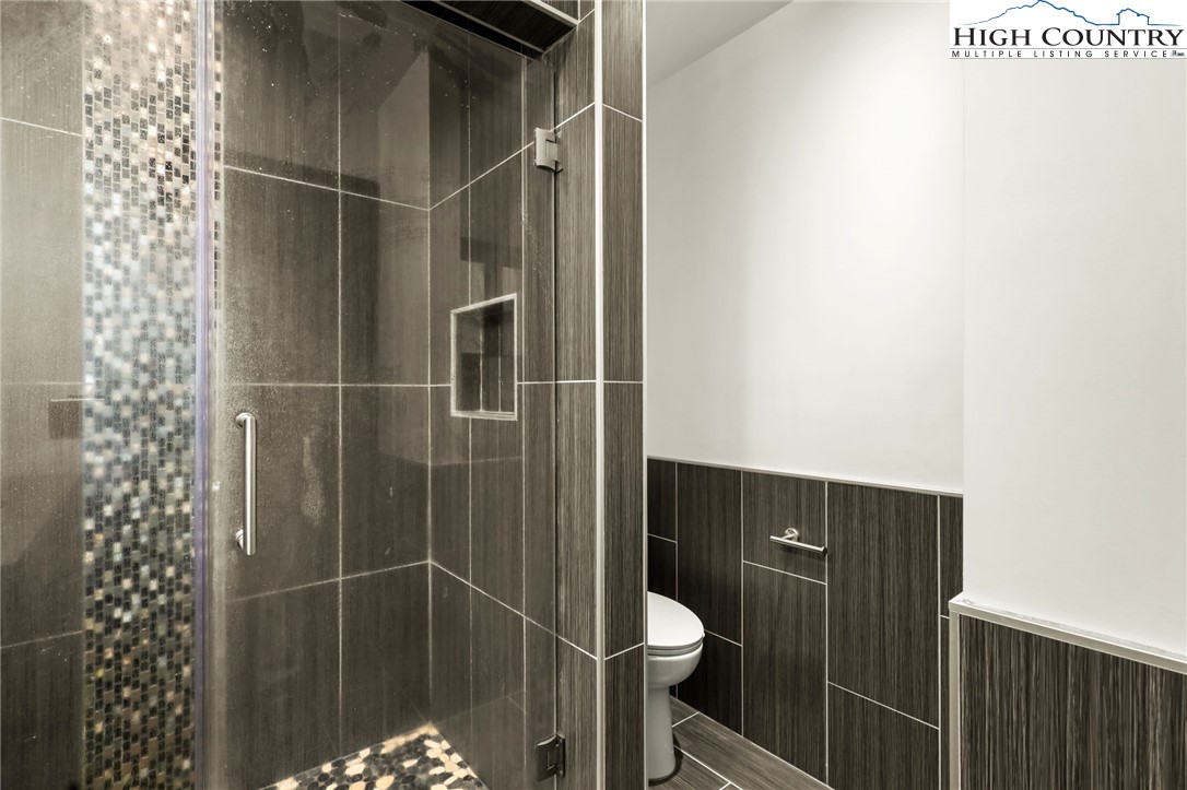 178 Brook Lane Boone, NC 28607 - Photo 27 of 48 a bathroom with a shower and toilet