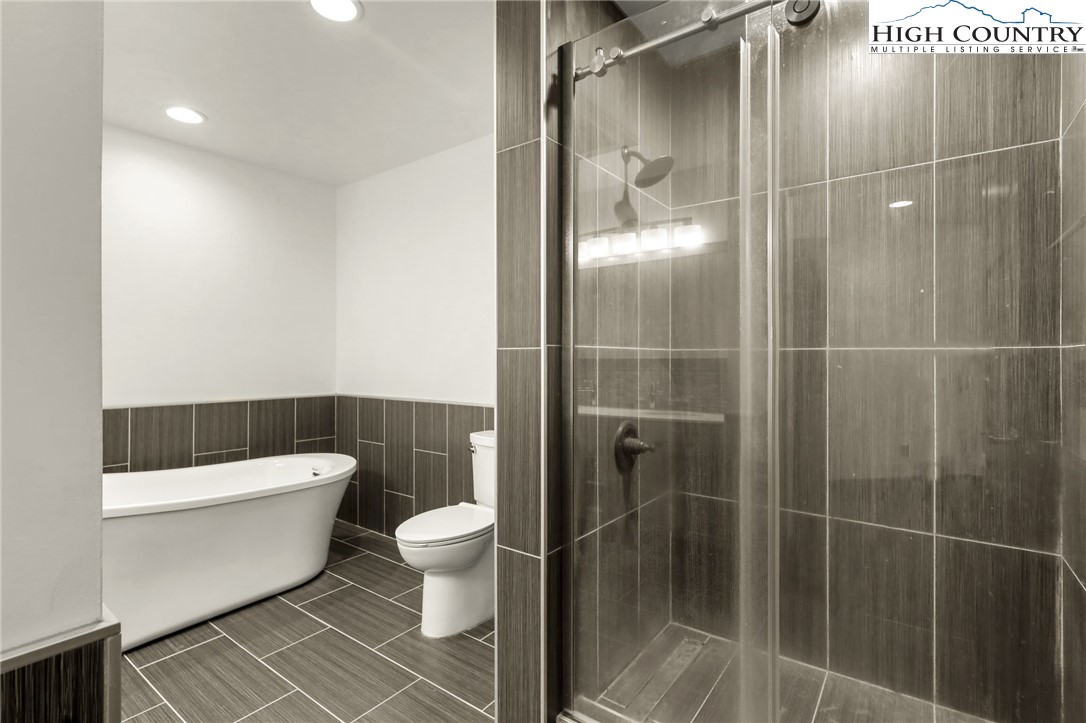 178 Brook Lane Boone, NC 28607 - Photo 31 of 48 a bathroom with a toilet and a shower