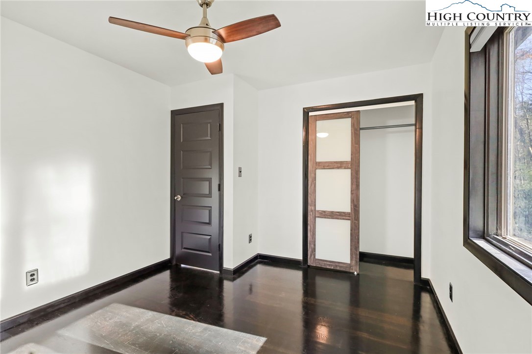 178 Brook Lane Boone, NC 28607 - Photo 37 of 48 wooden floor in an empty room with a window