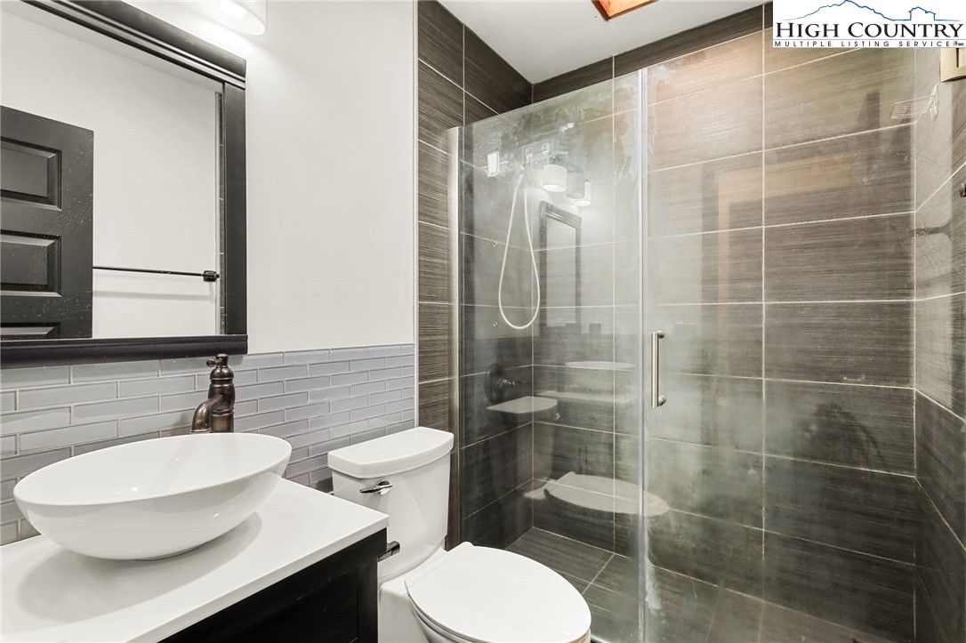 178 Brook Lane Boone, NC 28607 - Photo 40 of 48 a bathroom with a sink toilet and shower