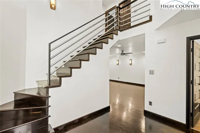 a kitchen with stainless steel appliances granite countertop a refrigerator and a stove