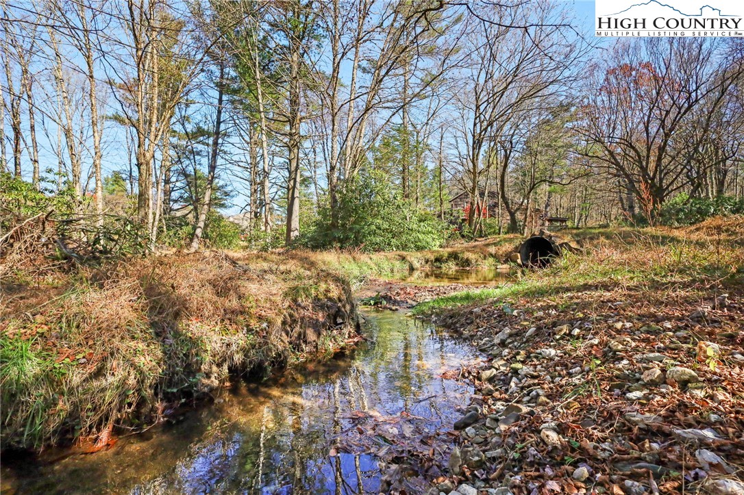 178 Brook Lane Boone, NC 28607 - Photo 48 of 48 a backyard of a house with a yard and large tree
