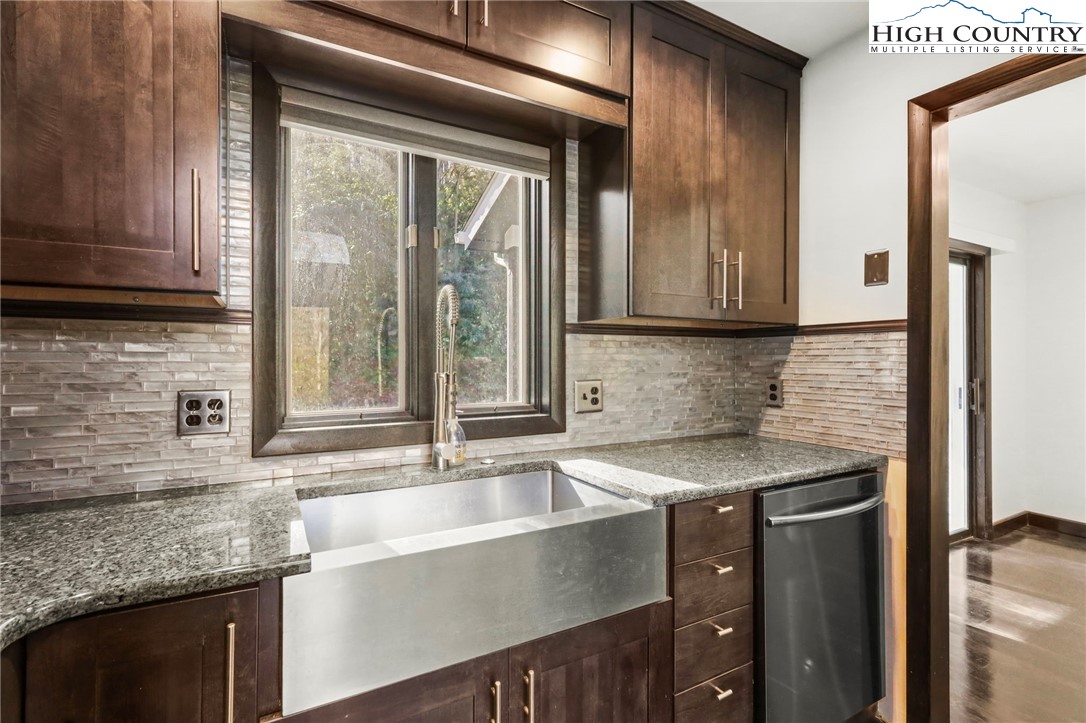 178 Brook Lane Boone, NC 28607 - Photo 8 of 48 a kitchen with granite countertop a sink and a window