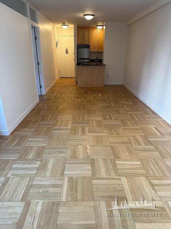a view of a kitchen with a sink