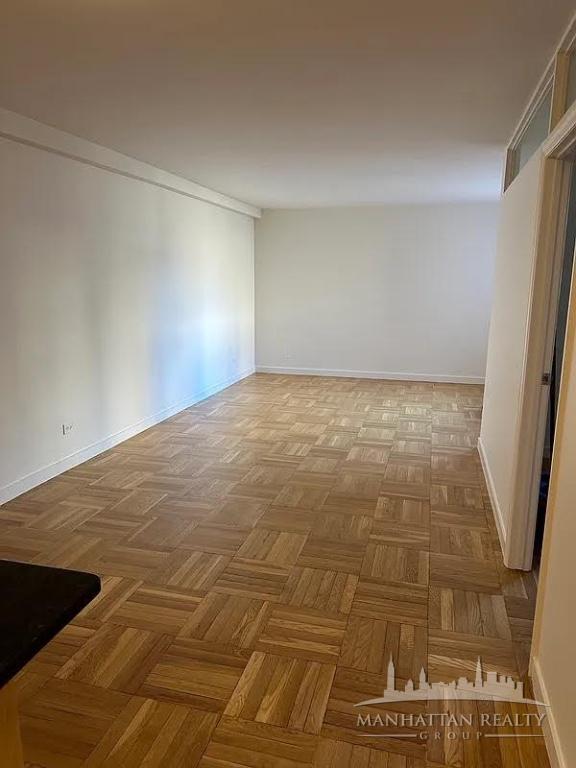 435 East 79th Street, Unit 9O Manhattan, NY 10075 - Photo 2 of 7 a view of an empty room
