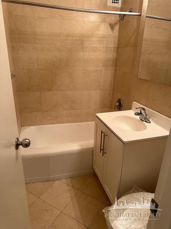 435 East 79th Street, Unit 9O Manhattan, NY 10075 - Photo 5 of 7 a bathroom with a sink a toilet and shower