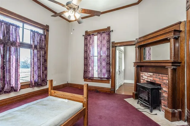 a living room with furniture fireplace and flat screen tv