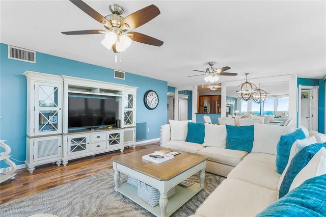 a view of a dining room with furniture large windows and wooden floor