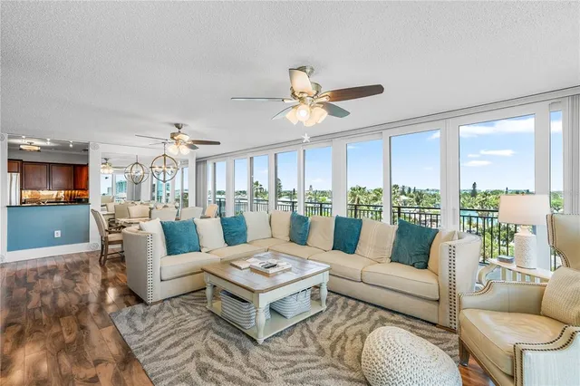 a view of a dining room with furniture wooden floor and chandelier