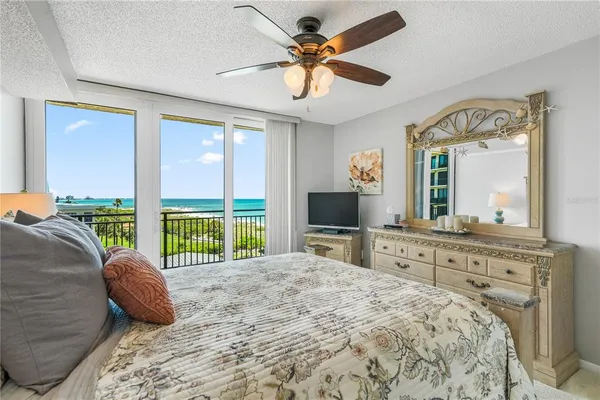 a kitchen with stainless steel appliances granite countertop a refrigerator a stove top oven a sink and dishwasher