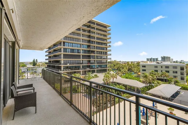 a view of a living room and a balcony