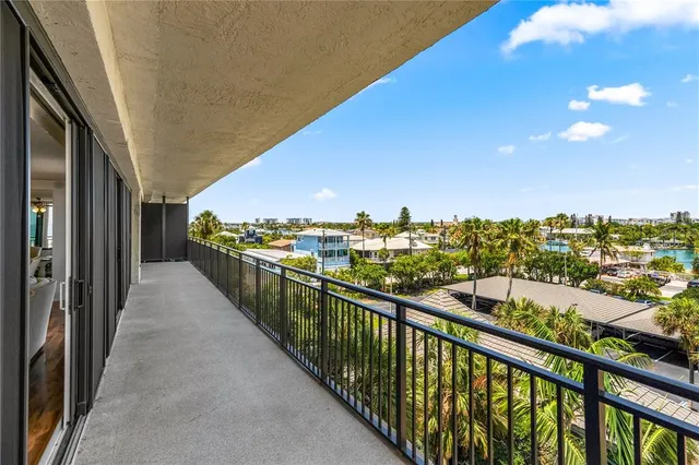 a view of a balcony with chairs