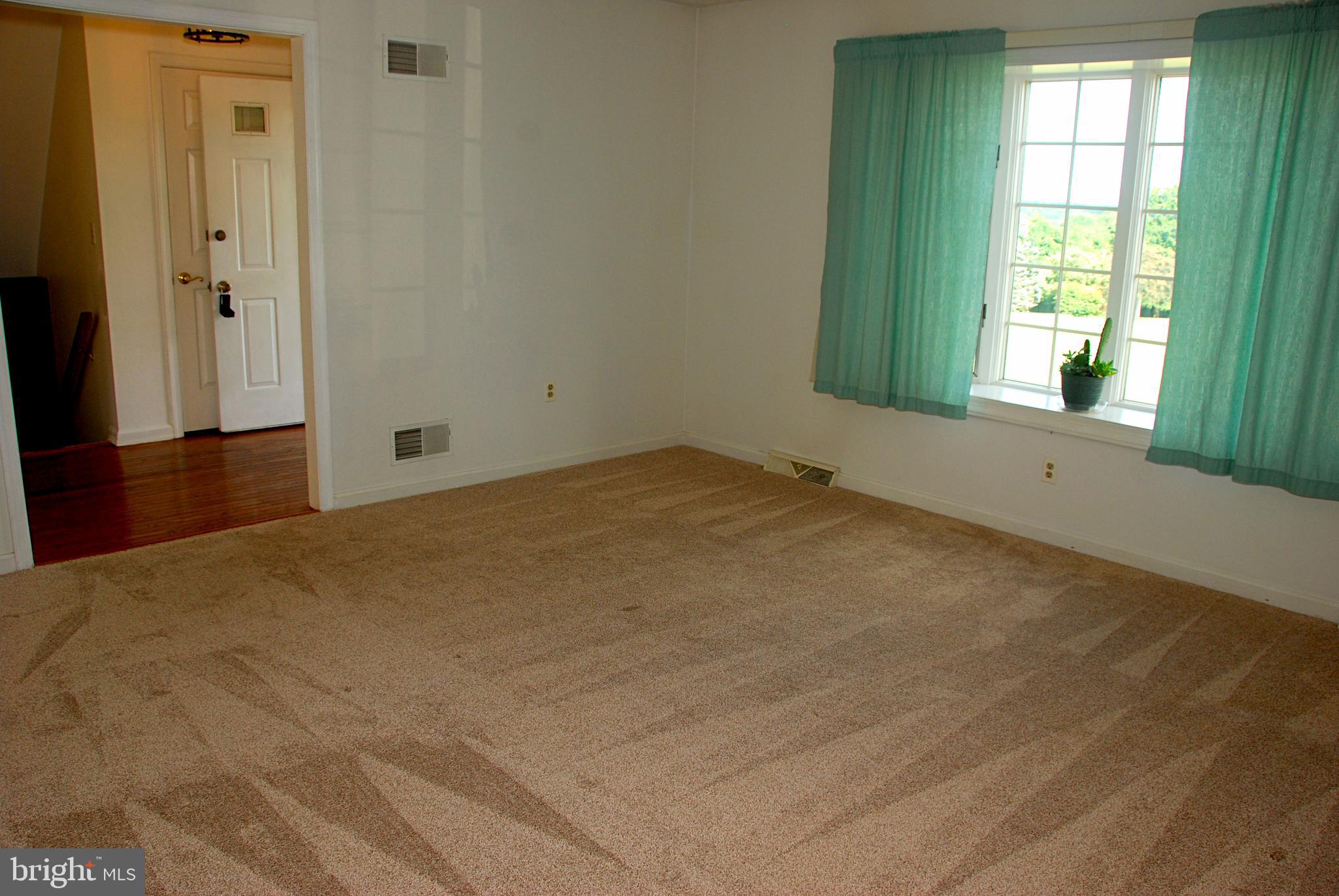 75 Roop Road Rising Sun, MD 21911 - Photo 6 of 30 Bright and sunny living room/office off of foyer