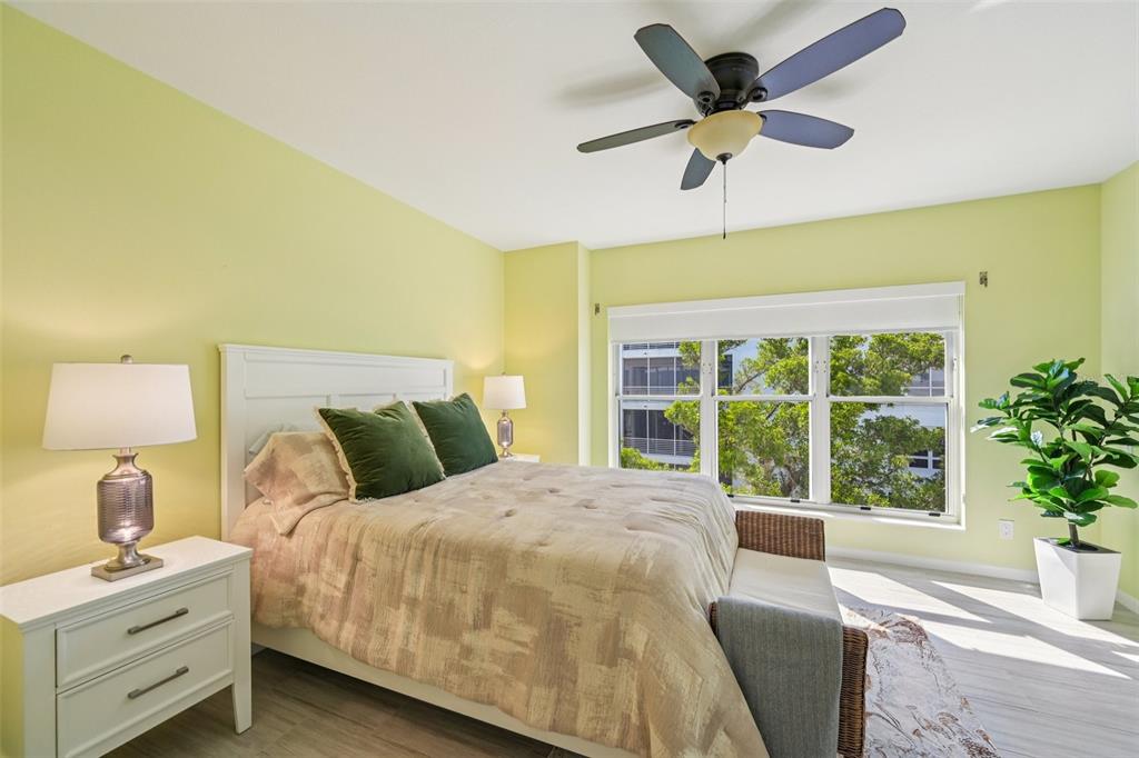 2450 Harbourside Drive, Unit 244 Longboat Key, FL 34228 - Photo 12 of 46 a bedroom with a bed and a window