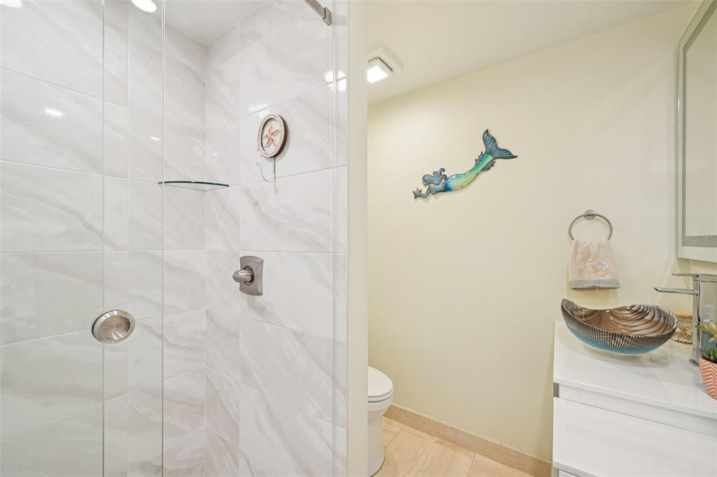 2450 Harbourside Drive, Unit 244 Longboat Key, FL 34228 - Photo 13 of 46 a bathroom with a shower