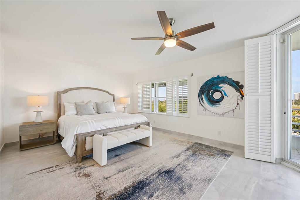 2450 Harbourside Drive, Unit 244 Longboat Key, FL 34228 - Photo 17 of 46 a bedroom with a bed and a window