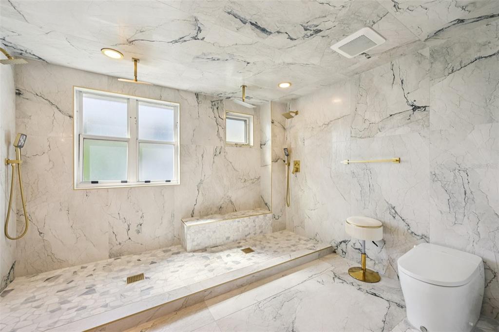 2450 Harbourside Drive, Unit 244 Longboat Key, FL 34228 - Photo 20 of 46 a bathroom with a sink toilet and shower