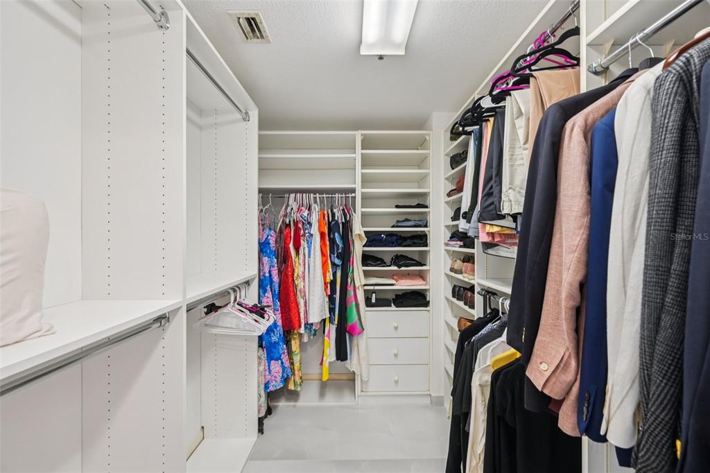 2450 Harbourside Drive, Unit 244 Longboat Key, FL 34228 - Photo 24 of 46 a view of walk in closet with clothes