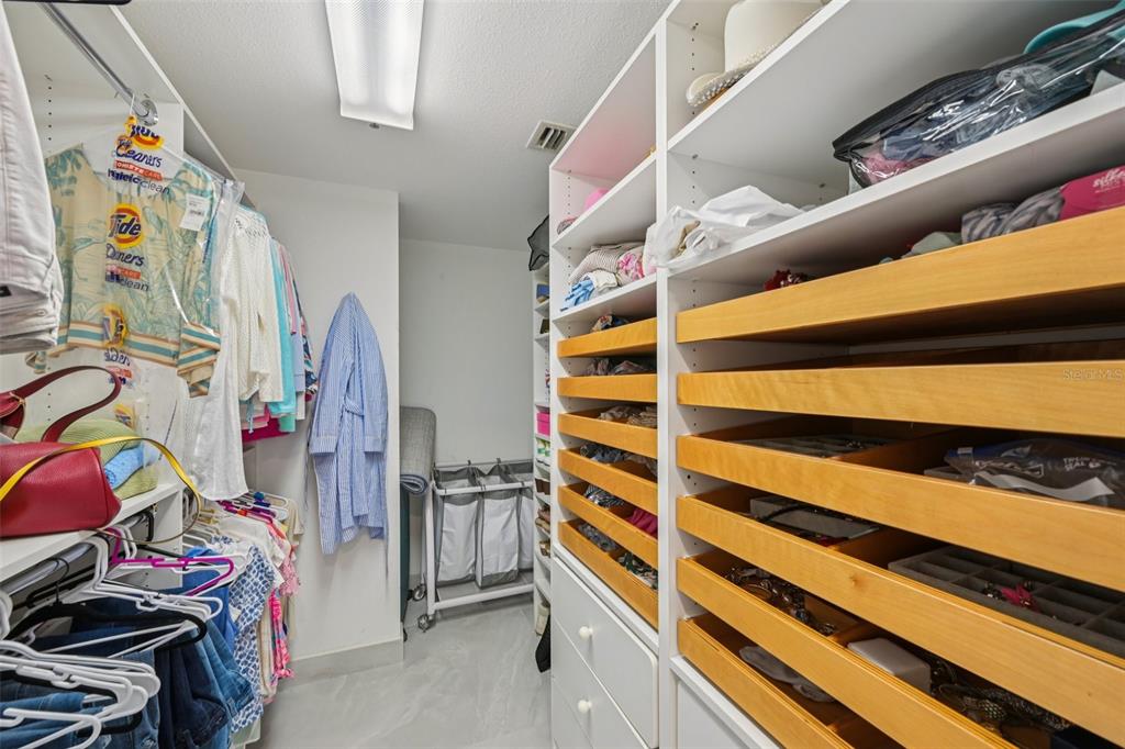 2450 Harbourside Drive, Unit 244 Longboat Key, FL 34228 - Photo 25 of 46 a view of walk in closet with clothes and shoes